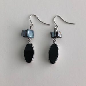 Black/chrome dangling earring with a stone on top